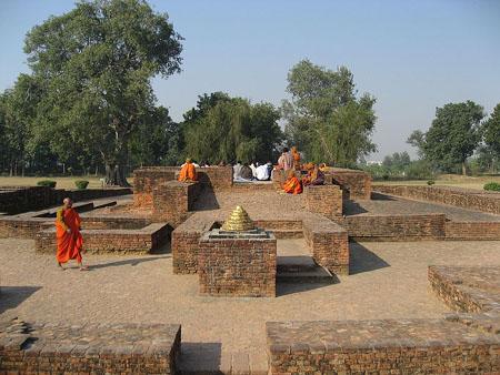 Scene in Jetavana, showing some small stupas.